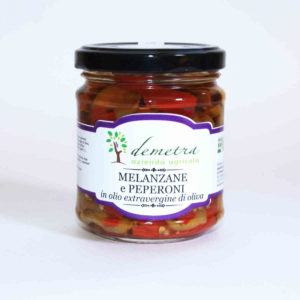 Aubergines and peppers in a oil jar
